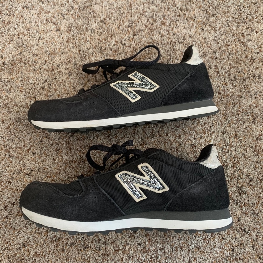 New Balance 311 black suede sneakers